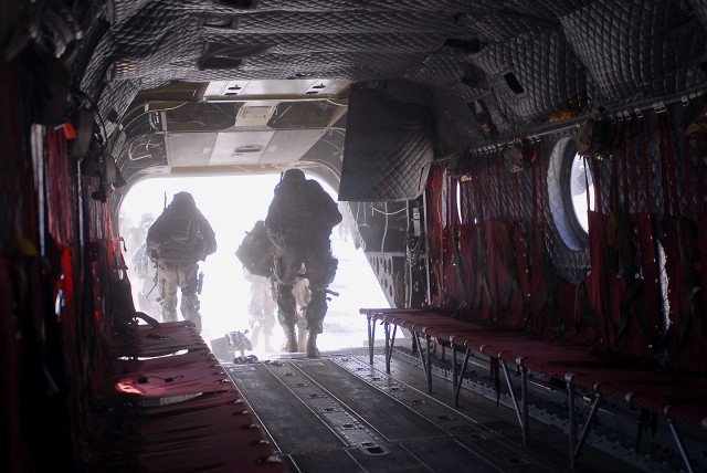 TAJI, Iraq- Soldiers from both the 3rd Brigade Combat Team, 82nd Airborne Division and the Iraqi Army make a rapid departure from a CH-47F Chinook helicopter before they perform a clearing operation, July 20, outside Ma-mil powerstation, Iraq. The ai...