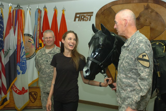 BAGHDAD - Academy award winning actress Angelina Jolie shares a light-hearted moment with Maj. Gen. Daniel Bolger (right), commanding general for 1st Cavalry Division and Multi-National Division-Baghdad and Command Sgt. Maj. Rory Malloy (left),...