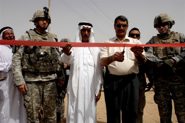 Capt. Marc J. Austin, commander of Headquarters and Headquarters Company, 1st Battalion, 12th Cavalry Regiment, Abdul Kareem Alamrear ,a city council representative from Imam Sharqi, Qayyarah Mayor Saleh and Lt. Col. Michael J. Fadden, commander...