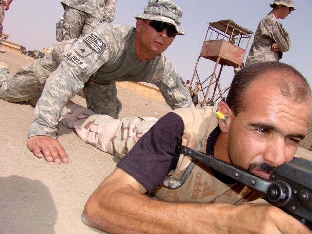 MAHMUDIYAH, Iraq -- Sgt. Jamie Glover of Wilson, N.C., a sniper section sergeant with Headquarters and Headquarters Company, 120th Combined Arms Battalion, 30th Heavy Brigade Combat Team, located in Wilmington, N.C., observes the shooting stance...