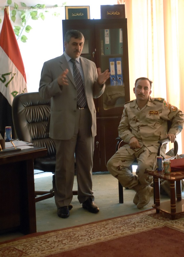 BAGHDAD - Shakr Fiza, Quimaqam of Abu Ghraib, address local government and religious leaders of Abu Ghraib about recent essential services projects in rural areas at the Abu Ghraib Youth Center July 26. "We want Abu Ghraib to succeed and we are worki...