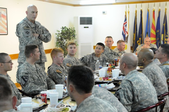 Gen. Raymond Odierno, Commanding General of Multi-National Forces Iraq, talks with Soldiers from Headquarters and Headquarters Company, 1st Battalion, 12th Cavalry Regiment, 3rd Brigade Combat Team, 1st Cavalry Division on July 25 at Forward...