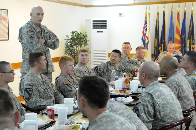 Gen. Raymond Odierno, Commanding General of Multi-National Forces Iraq, talks with Soldiers from Headquarters and Headquarters Company, 1st Battalion, 12th Cavalry Regiment, 3rd Brigade Combat Team, 1st Cavalry Division on July 25 at Forward Operatin...