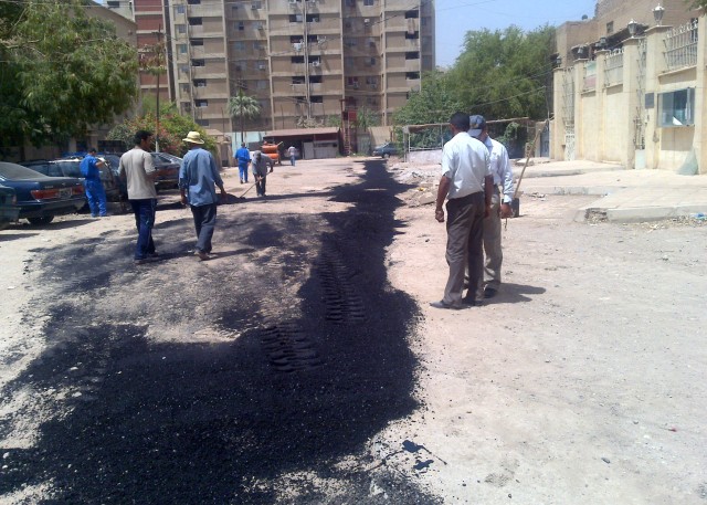 BAGHDAD -- Iraqi construction workers move forward with progress on the recently completed sewer network in the Salhiyah neighborhood of northwest Baghdad. The project was funded by coalition forces but the plan and execution were in the hands of loc...