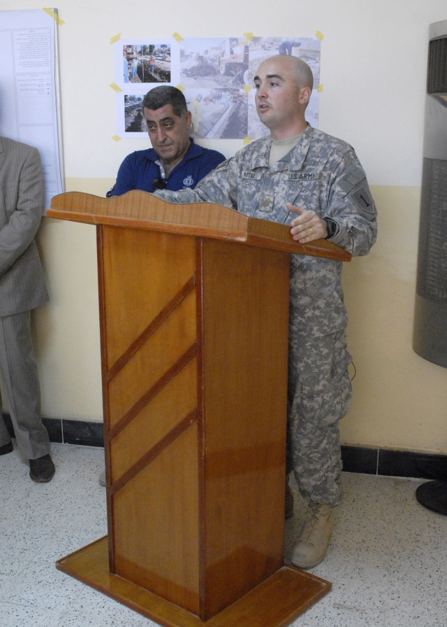 BAGHDAD - Maj. Andy Attar, a native of Bristol, Conn, Joint Project Management officer, 2nd Heavy Brigade Combat Team "Dagger," 1st Infantry Division, Multi-National Division - Baghdad, speaks to local Iraqi leaders from the Karkh district during the...