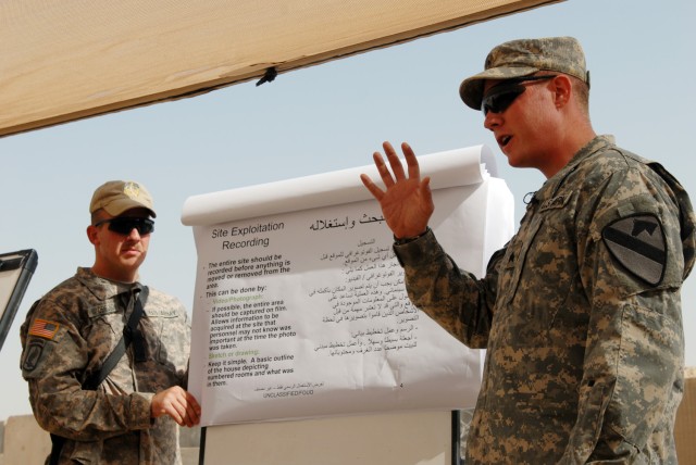 BAGHDAD - Sgt. Benjamin Vandenbosch (left), a cavalry scout gunner from Grand Rapids, Mich., and Sgt. Aaron Eckert (right), a cavalry scout from Spokane, Wash., both assigned to 1st Squadron, 7th Cavalry Regiment, 1st Brigade Combat Team, 1st...