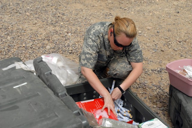 BAGHDAD - Orange County, Calif. native, Pfc. Candice Stark, medic for Company C, 115th "Muleskinners" Brigade Support Battalion, 1st Brigade Combat Team, 1st Cavalry Division, packs and inventories various medical equipment, July 28, in...