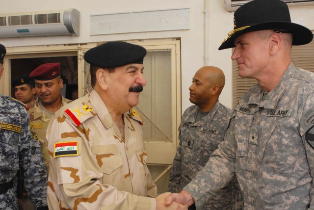 BAGHDAD - Staff Maj. Gen. Mizher Shaher Lateef (left), 11th Iraqi Army Division commander, shakes the hand of Kenton, Ohio native Brig. Gen. John Murray (right), the deputy commanding general for maneuver for 1st Cavalry Div., Multi-National...