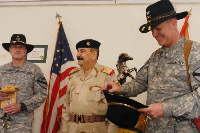 BAGHDAD - Kenton, Ohio native, Brig. Gen. John Murray (left), deputy commanding general for maneuver, 1st Cavalry Division, Multi-National Division-Baghdad and Sioux Falls, S.D. native Col. Tobin Green (right), commander, 1st "Ironhorse" Brigade...