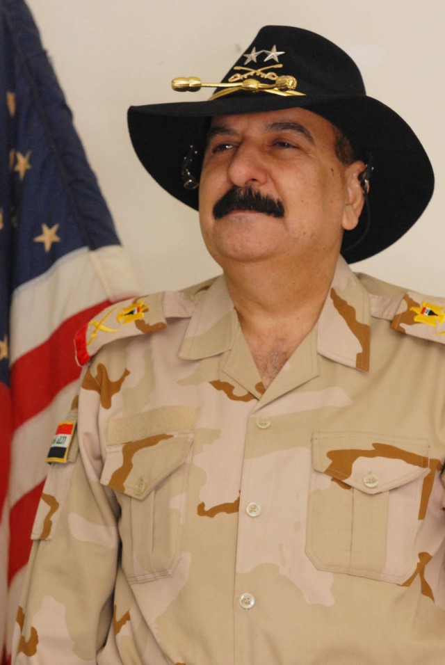 BAGHDAD - Staff Maj. Gen. Mizher Shaher Lateef, 11th Iraqi Army Division commander, proudly wears his 1st Cavalry Div. stetson presented to him by Kenton, Ohio native Brig. Gen. John Murray, deputy commanding general for maneuver, 1st Cav. Div.,...