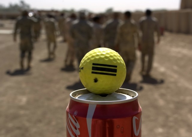 BAGHDAD - A golf ball stands in as a suitable target for a mixed crowd of Soldiers from the 2nd Battalion, 112th Infantry Regiment "Paxton Rangers," 2nd Heavy Brigade Combat Team, 1st Infantry Division, Multi-National Division-Baghdad and the 24th Br...