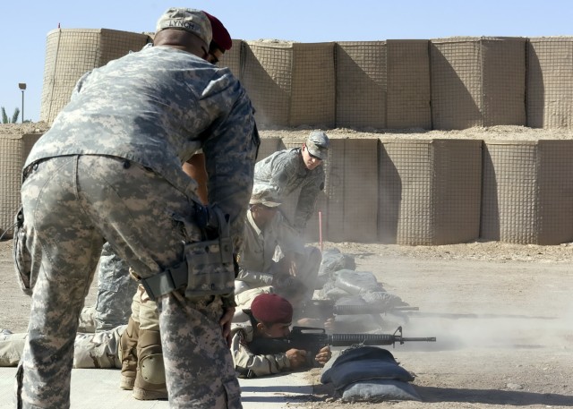 BAGHDAD - Staff Sgt. Matthew Lynch (foreground), of Mifflintown, Pa. and Sgt. Joseph McGowan (background), of Carlisle, Pa., both snipers from the 2nd Battalion, 112th Infantry Regiment "Paxton Rangers," 2nd Heavy Brigade Combat Team, 1st Infantry Di...