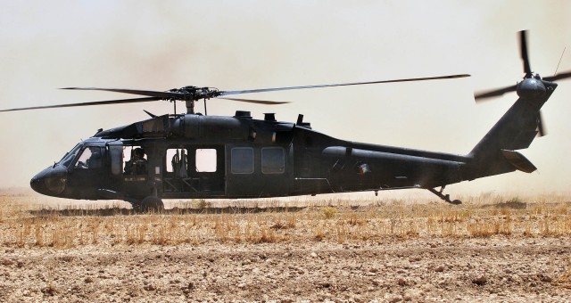 SHAKKAT, Iraq - A UH-60 Blackhawk helicopter lands in a remote field to pick up Iraqi and U.S. Army Paratroopers after conducting their final clearance in the town of Shakkat, Iraq during Operation Mufa-Ja'ah, a combined air assault mission, July 31....