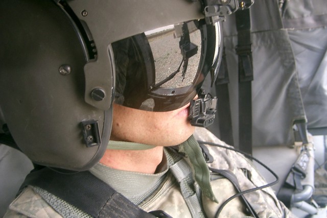 CAMP TAJI, Iraq-Sgt. Douglas Owens, from Azel, Texas, formerly a heavy wheeled vehicle operator for Company E, 2nd Battalion, 227th Aviation Regiment, 1st Air Cavalry Brigade, 1st Cavlary Division, Multi-National Division - Baghdad, looks out the...