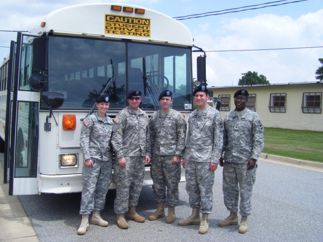 Band members take a break to become bus drivers