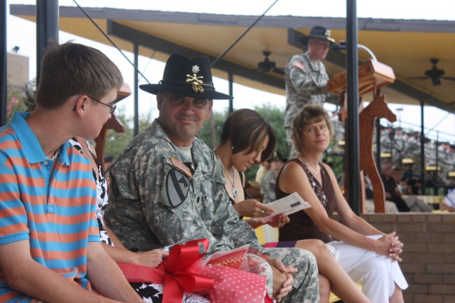 Lt. Col. Edward Bohnemann, Outgoing Commander of the 2nd Battalion, 7th Cavalry Regiment, 4th Brigade Combat Team, 1st Cavalry Division, turns to face his family, while Col. Philip Battaglia, Commander of the 4th Brigade Combat Team, 1st Cavalry Divi...