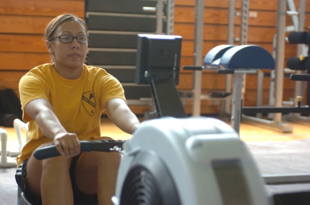 1st Lt. Maria Ige, a platoon leader with Headquarter and Headquarter Company, 4th Brigade Special Troop Battalion, 4th Brigade Combat Team, 1st Cavalry Division warms-up on the rowing machine before she starts her workout at the Fort Hood Wellness...