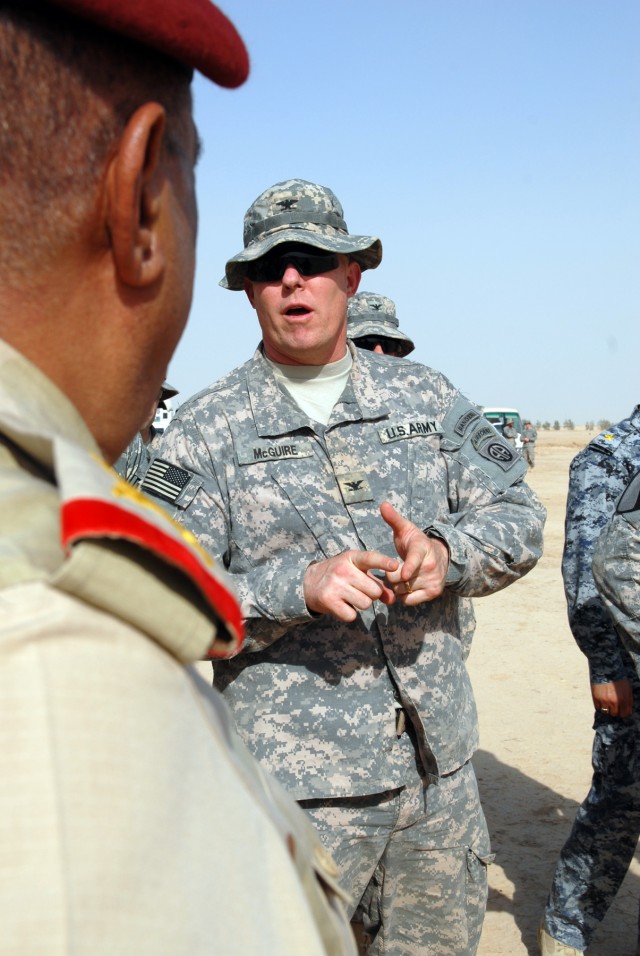 BAGHDAD - Col. Timothy McGuire, of Alamo, Calif., commander of 3rd Brigade Combat Team, 82nd Airborne Division, talks to Iraqi Army Gen. Abud Kanbar Hashim, commander of Baghdad Operational Command, during a visit by Hashim to observe the training of...