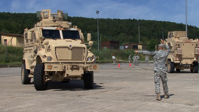 A Soldier ground guides a Mine Resistant Ambush Protected vehicle into its parking position during the Army's first MRAP Operators Course conducted in Europe at the Hohenfels Training Area, July 28-31. The first shipment of 40 MRAPs arrived in German...