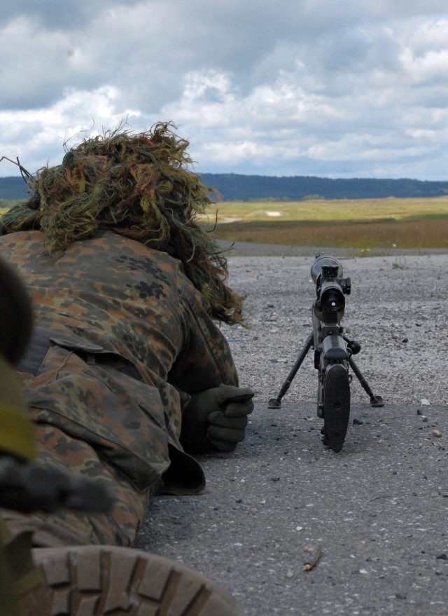 A German Special Forces soldier calculates distance to a target with his naked eye during a training exercise July 24, at the Grafenwoehr Training Area. The exercise was part of the International Special Training Centre's Sniper Course, an intense fi...