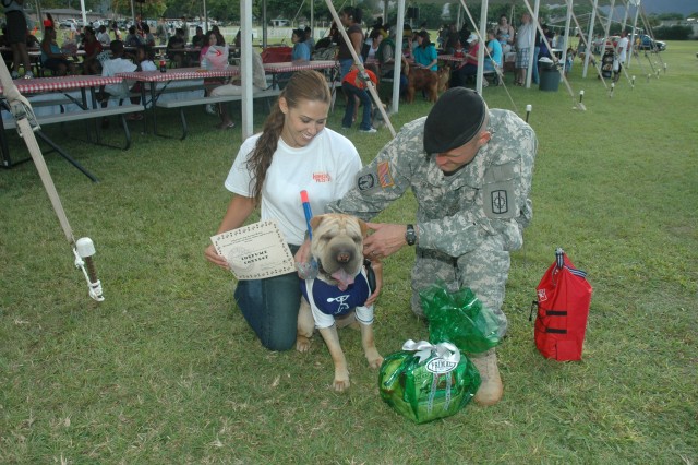 Dog Days of Summer: Dog owners strut their stuff at premier event