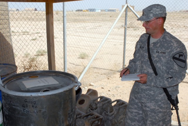 2nd Lt. Richard Miller, a preventive medicine specialist with Company C, 15th Brigade Support Battalion, 2nd Brigade Combat Team, 1st Cavalry Division, inspects storage barrels at a refueling point on Forward Operating Base Warrior, Kirkuk, Iraq, Jul...