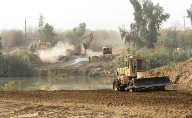 TAJI, Iraq - The Soldiers of 277th Engineer Company, 46th Engineer Battalion, 225th Engineer Brigade, work on the first step of a many step process to build a Mabey Johnson Float Bridge near Taji, Iraq. The huge undertaking requires 6,000 cubic...