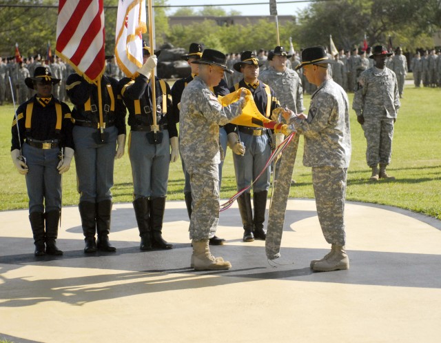 Col. Philip Battaglia, the outgoing commander of the 4th Brigade Combat Team, 1st Cavalry Division "Long Knives" and Command Sgt. Maj. Edwin Rodriguez, the senior enlisted Soldier for the Long Knife Brigade, uncase the unit's colors during the...