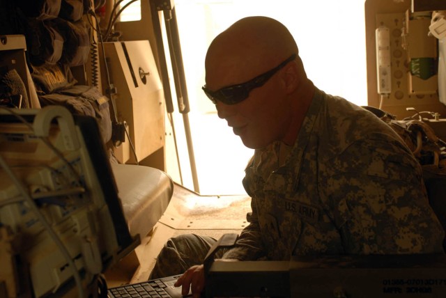 BAGHDAD - West Point, Ind. native, Sgt. Matthew Morris, the electronic warfare officer for 2nd Battalion, 5th Cavalry Regiment, 1st Brigade Combat Team, 1st Cavalry Division, checks the Counter Remote-Controlled Improvised Explosive Device...