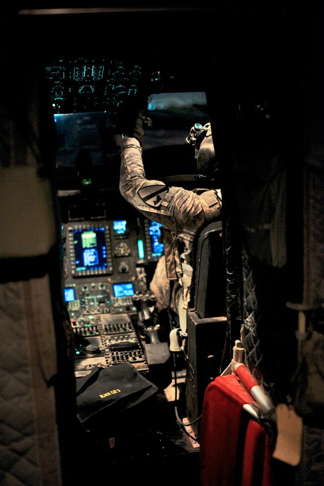 CAMP TAJI, Iraq-Before flight, Chief Warrant Officer 3 Roberto Torres, from Salinas, Puerto Rico, a CH-47F Chinook helicopter pilot in Company B, 2nd Battalion, 227th Aviation Regiment, 1st Air Cavalry Brigade, 1st Cavalry Division, Multi-National...