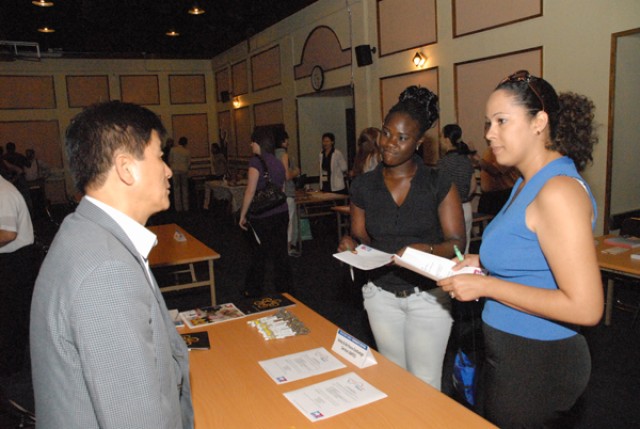 Family members search opportunities at job fair