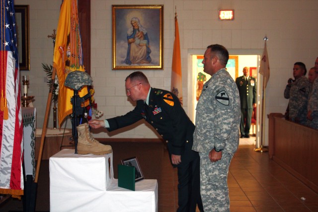 Lt. Col. Joseph Holland, Commander of the 2nd Battalion, 12th Cavalry Regiment, 4th Brigade Combat Team, 1st Cavalry Division, "Thunder Horse" troopers and Command Sgt. Maj. William May, the senior enlisted leader for the battalion, pay tribute to th...