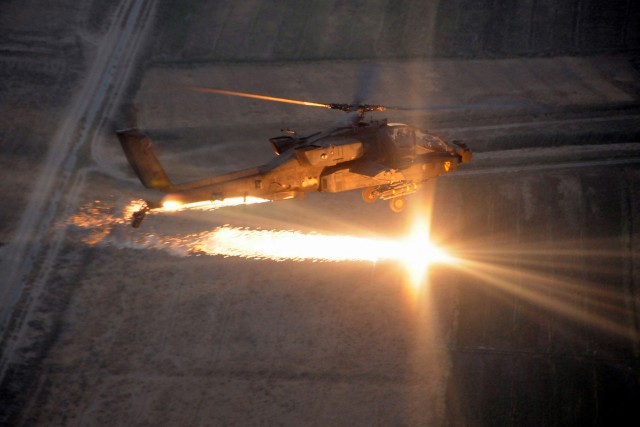 CAMP TAJI, Iraq-An AH-64D Apache attack helicopter from Company B, 1st Battalion, 227th Aviation Regiment, 1st Air Cavalry Brigade, 1st Cavalry Division, Multi-National Division - Baghdad, fires self-protection flares while conducting combat...