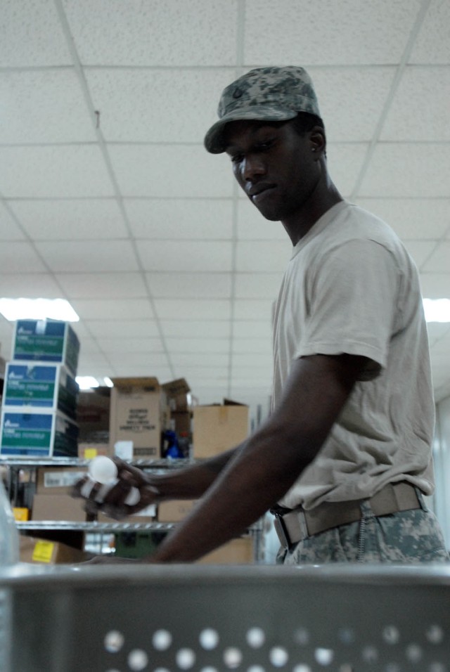 BAGHDAD - Newport, R.I. native, Pfc. Andre Barrett, a cook assigned to 1st Battalion, 5th Cavalry Regiment, attached to the 1st "Ironhorse" Brigade Combat Team, 1st Cavalry Division, prepares boiled eggs for breakfast, Aug. 18, at Joint Security...
