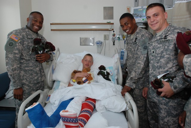 Paratroopers bring cheer to sick kids