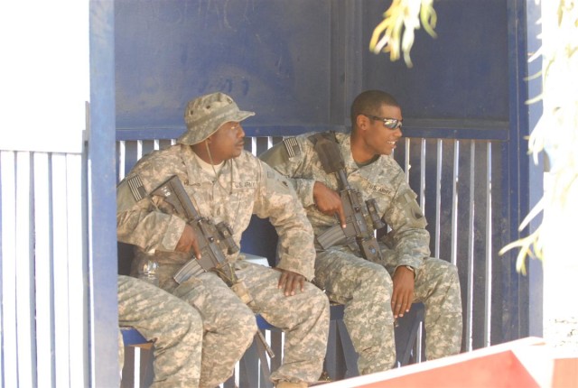 Soldiers work with local nationals