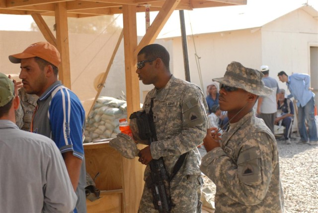 Soldiers work with local nationals