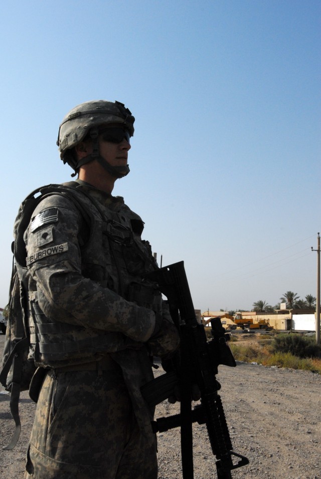 CAMP TAJI, Iraq- "Dismounted patrols make the days fly by, it seems to make our time here go faster," said Pennsboro, W. Va. native Spc. Christopher Burrows, a forward observer assigned to Headquarters and Headquarters Battery, 1st "Dragon" Battalion...