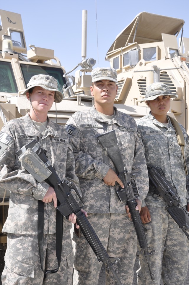 KANDAHAR AIRFIELD, Afghanistan - 286th Combat Support Sustainment Battalion fuelers, Spc. Dana S. Osborne from Lake Butler, Fla., Pfc. Jeffrey Wiedel from Killeen, Texas and Pfc. Jose L. Garcia from Chicago, Ill., were each awarded the Purple Heart M...