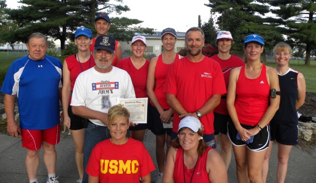 Harold Greenwell, from Evansville, Ind., whose son Staff Sgt. Justin Greenwell, currently deployed to Iraq with 3rd Heavy Brigade Combat Team, 1st Cavalry Division, stands among fellow members of 'The Freedom Runners of Evansville'. A group of...