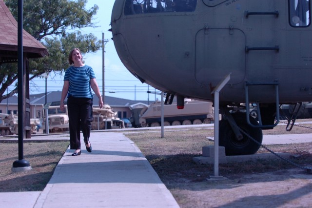 Lori Wiggins, a military spouse from Greenville, Texas, passes a helicopter as she walks along the pathway outside the 1st Cavalry Division's museum Sept. 1, at Fort Hood, in support of Soldiers like her husband, Sgt.1st Class James Wiggins,...