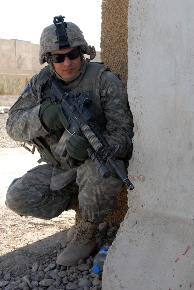 CAMP TAJI, Iraq - Austin, Texas native, Pfc. Zachary Sherman, a tanker assigned to the 1st "Black Knight" Battalion, 5th Cavalry Regiment attached to the 1st Brigade Combat Team, 1st Cavalry Division, pulls security in northern Baghdad Aug. 23....