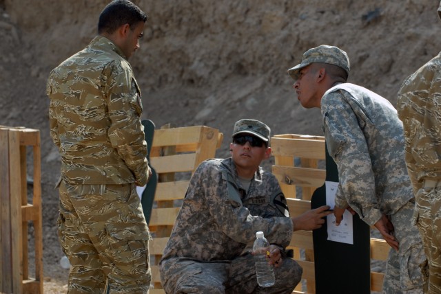 BAGHDAD - "We're training these guys up so they can become a recon platoon for the 6th Iraqi Army," he said. "We're working on zeroing their weapons so they can become accurate when they engage the enemy." Spc. Zack Julien (center), from Bakersfield,...