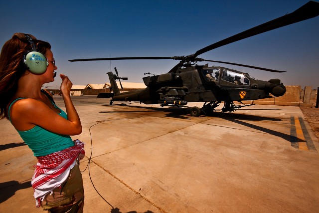 CAMP TAJI, Iraq-As AH-64D Apache attack helicopter pilots from 1st Battalion, 227th Aviation Regiment, 1st Air Cavalry Brigade, 1st Cavalry Division, Multi-National Division - Baghdad, prepare for a mission, Lisa Jay, an actress, wishes the pilots go...