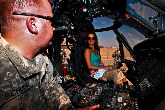 CAMP TAJI, Iraq-Chief Warrant Officer 2 Travis Schubbe (left), from Mankato, Minn., a UH-60 Black Hawk medevac helicopter pilot, for Company C, 2nd Battalion, 227th Aviation Regiment, 1st Air Cavalry Brigade, 1st Cavalry Division, Multi-National Divi...