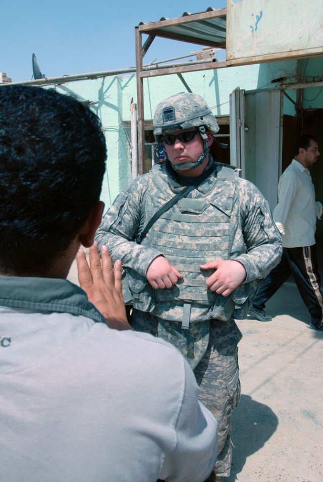 TAJI, Iraq- Whitewater, Wis., native, Staff Sgt. Nicholas Lien, the civil capacity and essential services officer assigned to Headquarters and Headquarters Battery, 1st "Dragon" Battalion, 82nd Field Artillery Regiment, 1st Brigade Combat Team,...
