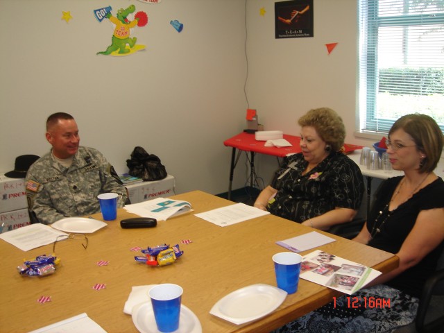 Lt. Col. Gerald Boston, commander of the 2nd Battalion, 7th Cavalry Regiment, 4th Brigade Combat Team, 1st Cavalry Division meets with Venable Village principal Cynthia Potvin to discuss upcoming events for the school year. Venable Village is the...