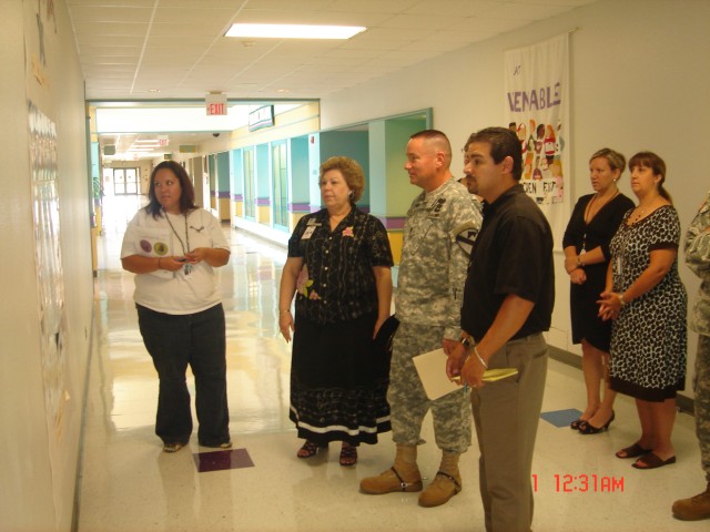 Faculty of Venable Village elementary school take Lt. Col. Gerald Boston, commander of the 2nd Battalion, 7th Cavalry Regiment, 4th Brigade Combat Team, 1st Cavalry Division, on a tour of the school.  The 'Ghost' Battalion adopted Venable Village...