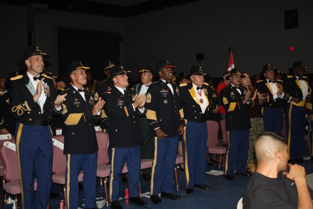 The 4th Brigade Combat Team, 1st Cavalry Division "Long Knife" leadership cheers after Sgt. Reshard Hicks wins the Fort Hood and III Corps boxing championship for the 154-165 weight class held at the base's Abrams Field House Sept. 9 -15. Hicks was o...
