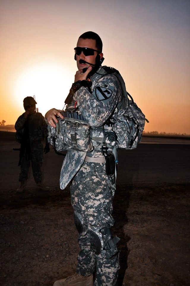 TAJI, Iraq-Making a radio call to higher up, Capt. Dave Puzzo, from East Hampton, Conn., a UH-60 Black Hawk helicopter pilot and commander of Company F, 3rd Battalion, 227th Aviation Regiment, 1st Air Cavalry Brigade, 1st Cavalry Division,...